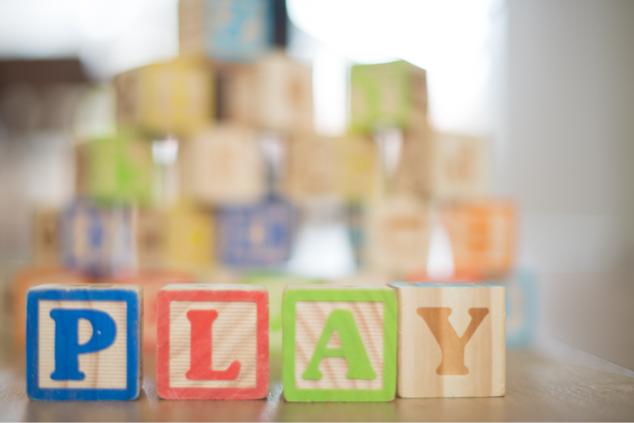 Wooden blocks that spell out PLAY